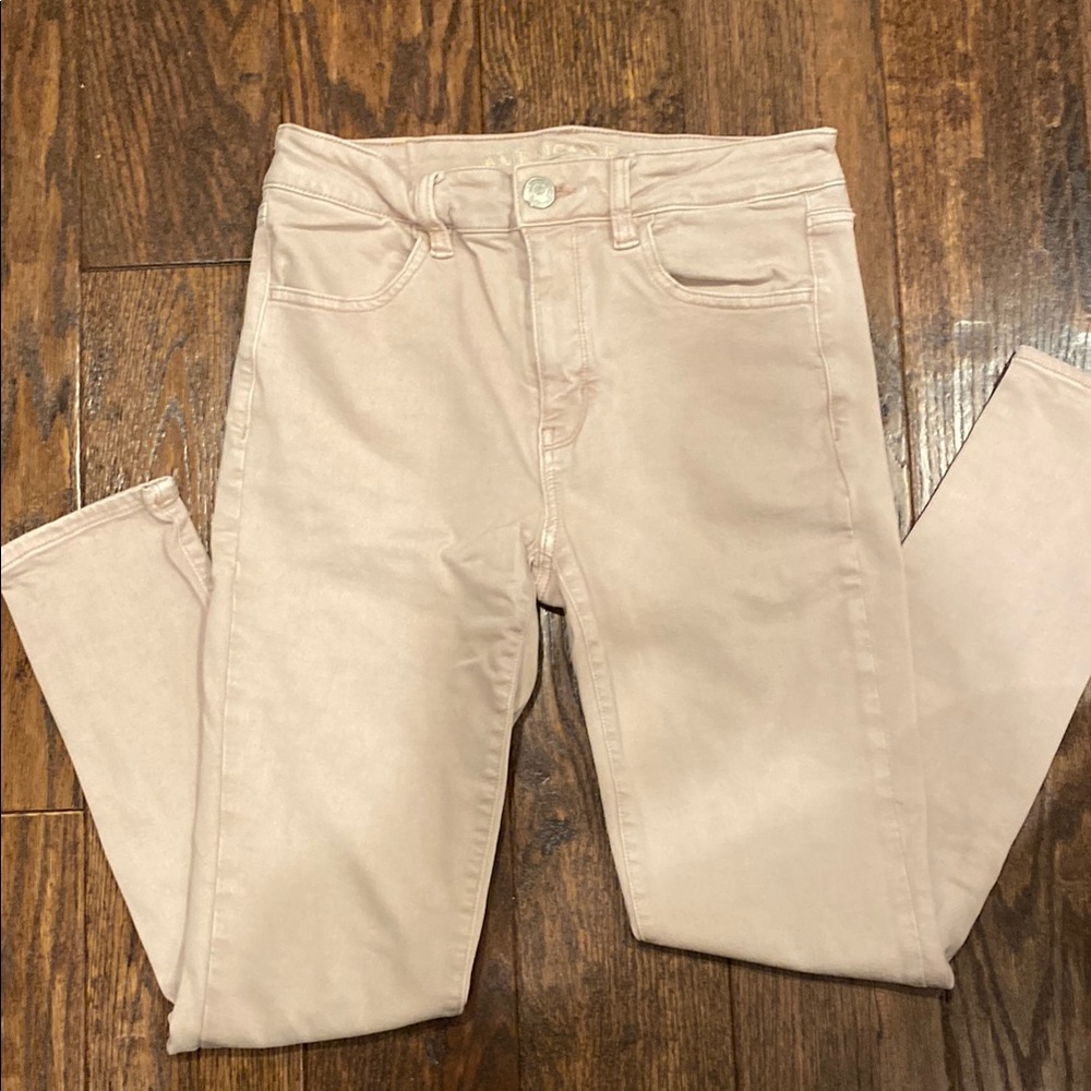 Women's Cream Jeans American Eagle light pink in color